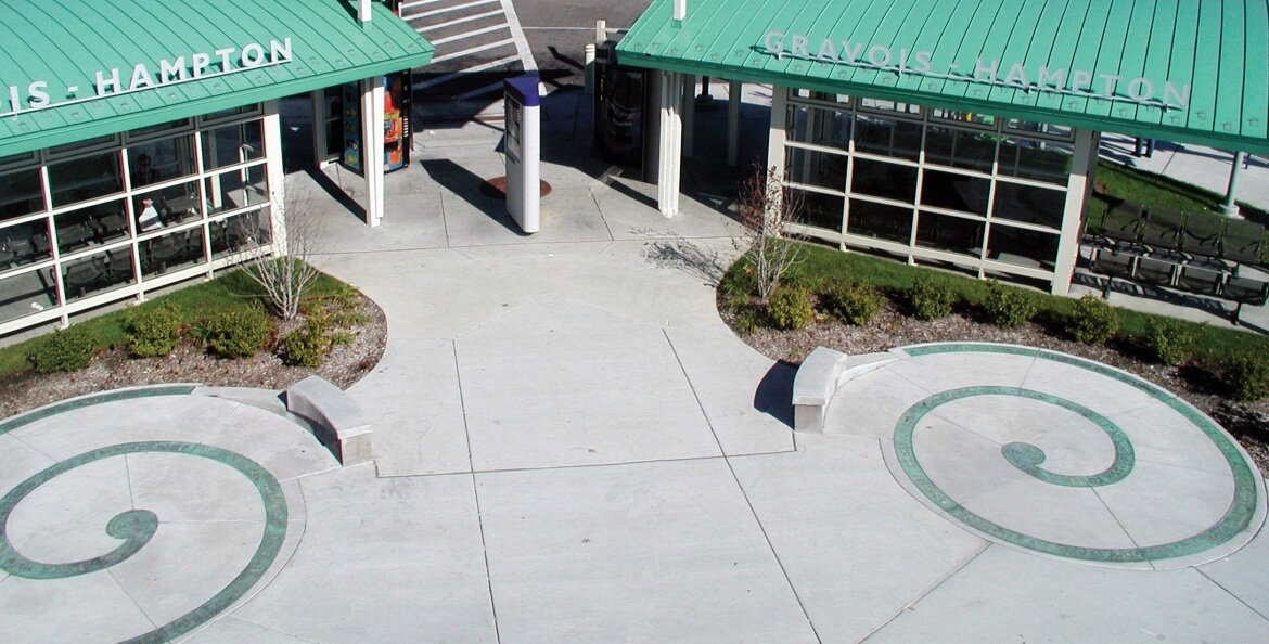 Poetry Spirals is composed of two brass spirals embedded in the plaza of the Hampton-Gravois Transit Center and was created by artists Con Christeson and Phil Robinson. A poem is inscribed on the spirals, beginning on one and ending on the other.