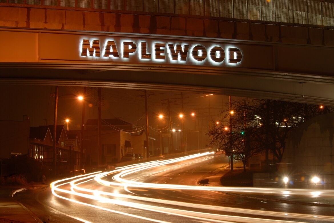 If You Lived Here You'd Be Home is a public art installation by artist Janet Zweig at the Maplewood-Manchester MetroLink station. Two illuminated signs made from construction materials spell out MAPLEWOOD, with one written forawrds and one written backwards.