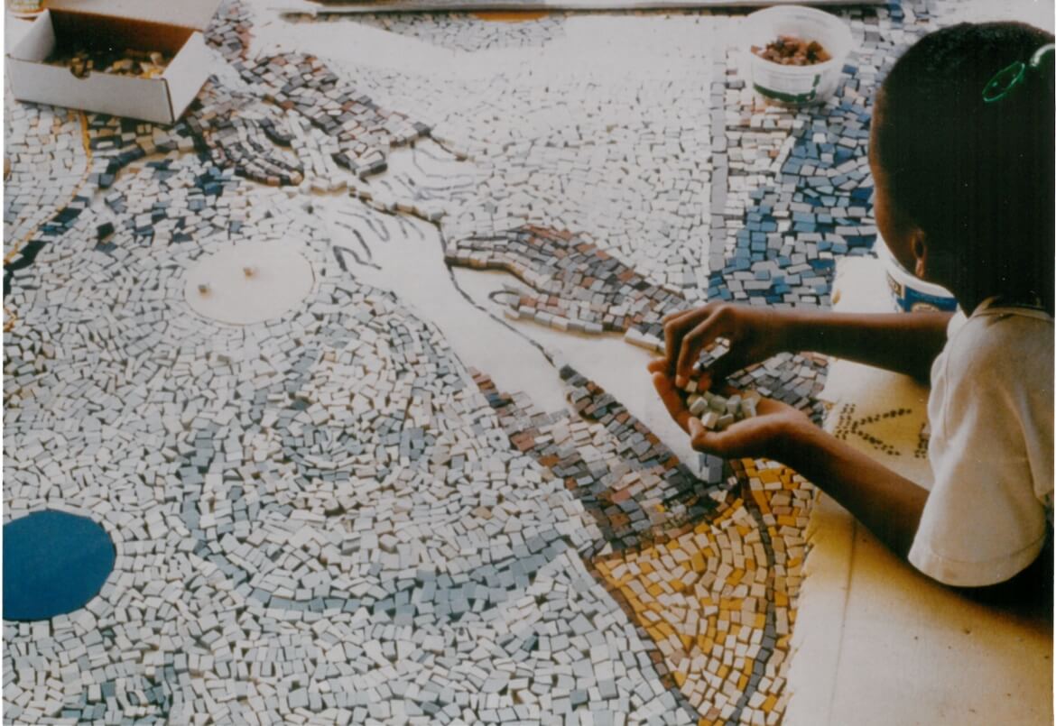 The Magic Carpet mosaic was created by Hyde Park children and residents as a memorial to six children killed in a house fire. Artists Janet Sanders and Saaba Buddenhagen acted as facilitators for the project.